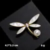 Broche de concha de imitación de diamante, alfiler de perla anti-luz de nicho, alfiler de ramillete de aleación, en stock, accesorios de ropa al por mayor