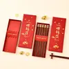 Palillos para ganar dinero Qinglan en stock 5 pares de palillos caja caja de regalo caja de embalaje palillos de titanio palillos de madera de ala de pollo caja de papel caja vacía