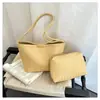 Estilo europeo y americano transfronterizo, tejido retro inspirado en Corea 2026, bolsa de mano y bolso de hombro tipo cubo casual simple de textura suave para mujer