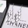 ¡Guau!Moda Transfronteriza Europea y Americana, Varios Pendientes Largos Metálicos de Borla Exagerada de Estilo Moderno con Elementos Elegantes