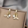 Versión coreana de aretes de perlas geométricas simples, populares en internet, exquisitos, para ir al trabajo, comodín, de alta gama, aretes de plata, venta al por mayor