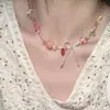 Collar de cuentas de color dulce "Burbuja de Fresa" con diseño de nicho de verano y lazo con corazón rojo.