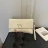 Comércio Exterior Laço Artístico Feminino 2026 PU Estilo Coreano Tendência Design de Moda Bolsa Envelope Clutch da Moda