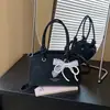 Bolso de mano para mujer modelo nuevo 2026, gran capacidad, diseño de nicho, bolso de hombro casual, bolso cruzado tipo cubo de mano