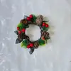 Productos de venta caliente transfronterizos directamente del fabricante: Coronas decorativas de Navidad, portavelas de pared, decoraciones colgantes para puertas, guirnaldas de frutos rojos