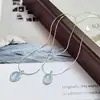Colar de Pedra da Lua Água-Marinha Design de Nicho Feminino Pingente Oval de Alto Padrão Luxo Acessível Moda Corrente Ossinho de Cobra Nova Tendência