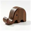 Soporte creativo de madera maciza para teléfono con forma de elefante, un soporte perezoso para tu escritorio, un soporte multifuncional para tableta y pieza decorativa