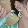 Pendientes de resina con forma de estrella de mar y concha de aguja plateada, pendientes exquisitos estilo resort costero, pendientes de diseño nicho para mujer con un toque de alta gama