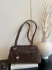 Coleção nova de 2026: bolsa pingente em formato de estrela, uma bolsa de mão elegante e sofisticada para mulheres, uma bolsa de ombro versátil e uma bolsa prática para o dia a dia