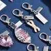 Nuevo Colgante Metálico Rosa Plateado Forma de Corazón Botella de Perfume de Cereza Llavero Accesorio Versátil para Bolsa Venta al por Mayor Dropshipping