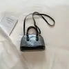 Bolso Pequeño para Mujer 2026 Primavera Nueva Moda Retro Bolso de Mano Forma de Concha Bolso Cruzado de Hombro Simple Casual Bolso de Mujer