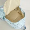Mochila fresca y sencilla de lunares con lazo para mujer, nuevo modelo 2026, mochila versátil de gran capacidad para estudiantes de secundaria y preparatoria