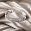 Moda Europeia e Americana Pulseira de Metal Aço Titânio para Mulheres com Design Geométrico Diamante Fivela de Mola Pulseira Recortada Série de Emendas Multicamadas