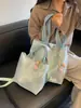 Bolso de mujer suave y liso de alta calidad, nuevo modelo 2026, bolso tote de gran capacidad para el trabajo diario, bolso de hombro versátil para comercio exterior