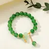 [Venta al por mayor directa de fábrica] Nuevo estilo chino Imitación Jade Dongling Puesto de Exhibición de Feria de Templo del Mercado Nocturno Pulsera de Vidrio Joyería Más Vendido
