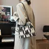La bolsa popular de este año 2023 nueva moda en línea popular bolsa tote para mujer gran capacidad Bolso de hombro de lona para mujer