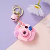 Llavero de Cámara de Proyección Sanrio Dibujo Animado Brillante Colgante para Mochila Juguete de Puesto Callejero Al Por Mayor Luminoso