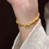 Pulseira com Laço Estilo Princesa Explosão Livro Vermelho Pequeno 2025 Novo Estilo Antigo Pequenas Contas Douradas Pulseira Escovada Ouro Quebrado