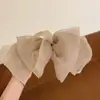 Clip de resorte con lazo de perla, accesorio para el cabello de alta gama, elegante y francés para celebridades de Internet.