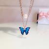 Conjunto de pendientes y collar de moda transfronteriza europea y americana, nuevo diseño de verano, con doble perla, aceite y mariposa, colgante para mujer.