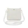 Bolso cubeta tejido de paja simple, elegante modelo nuevo 2026, diseño de nicho minimalista, bolso cubeta tejido de hombro y cruzado