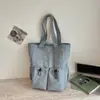Bolsa tote casual minimalista de nicho estilo coreano em nylon com design único, grande capacidade, alto apelo estético e design de fecho de cordão, adequada para carregar na mão ou no ombro