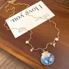 Colar com Pingente de Flor em Concha de Pérola Cravejado com Diamantes Estilo Resort Boêmio Corrente para Clavícula Colar de Nicho de Luxo para Mulheres