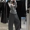 Tejido de punto gris coreano para mujer, diseño nuevo de principios de primavera de 2025, top ajustado de manga larga, camiseta interior de cuello bajo