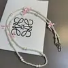 Ins Simple Estilo Nuevo Perla Lazo Con Cuentas Cadena Cruzada Cadena Colgante Accesorios Cadena Colgante Lanyard para Teléfono Móvil Cruzado Grabable Mismo Estilo