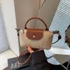 Bolsa Transversal de Palha Tecida Transfronteiriça Feminina 2026 Nova Bolsa de Mão de Palha de Verão Bolsa de Nicho Versátil Bolsa de Ombro Fashion