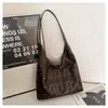 2026 Nuevo Estilo Bolso Tote de Moda de Gran Capacidad para Mujer con Diseño Único Versátil Bolso de Hombro para Viajes de Mujer