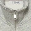 Jaqueta de moda europeia e americana estilo U 2026 nova elegante Amazon feminina atacado bolso com zíper duplo