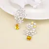 Europa y Estados Unidos pendientes largos de personalidad de moda irregulares largos micro incrustados color diamante amarillo tesoro pendientes de alto sentido al por mayor