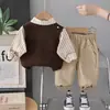 Conjunto de Ropa Otoño 2026 Primavera Otoño Nuevo Estilo Niños Versión Coreana Suéter Chaleco con Letra Conjunto de Tres Piezas Ropa de Moda