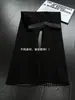 Pantalones de chándal de cuadros patchwork deconstruidos negros para hombre, marca de tendencia de otoño, pantalones rectos de alta gama que estilizan, pantalones de microcampana estilo americano