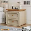 Mesa de Cabeceira Usada para Quarto de Casa 2026 Novo Modelo Creme Luxo Leve High-End Madeira Maciça Pequeno Armário de Armazenamento de Cabeceira