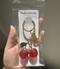 Acessórios para Chaveiro Venda Quente Transfronteiriça Itens Populares Loja de Departamento Chaveiro de Cereja Dourado Elegante Acessórios de Pingente para Bolsa de Alta Qualidade