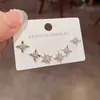Conjunto de Brincos Três Peças Estrela de Metal Cravejada de Diamantes Simples, Moda Japonesa e Coreana, Luxo Leve, Design Versátil e Único