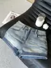 Shorts de mezclilla estilo retro americano para mujer, diseño de verano ajustado para cuerpo tipo pera, hot pants de línea A que realzan la cadera
