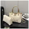 Nuevo Conjunto Elegante de Dos Piezas con Estampado Lindo 2025 Moda Madre-Hija Bolso de Mano Texturizado Simple para el Trabajo Bolso de Hombro para Mujer