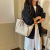 Bolsa Tote Grande Capacidade Feminina 2026 Novo Estilo Bolsa de Ombro Simples Nicho Versátil Diária Tecida Bolsa para o Trabalho