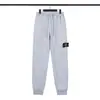 Calça de Moletom com Emblema de Bússola de Pedra Europeia e Americana Transfronteiriça Calça Esportiva Casual Funcional Calça Longa Tricotada Estilo Ilha Unissex Tendência