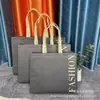 Bolsa de mano no tejida laminada moda personalizada tienda de ropa bolsa de alto nivel personalizada bolsa promocional de compras al por mayor