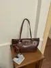 Comércio exterior transfronteiriço estilo coreano bolsas de nicho femininas nova bolsa de ombro alta super quente retrô elegante para o dia a dia