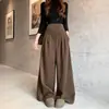 Pantalones de maternidad para otoño e invierno: Pantalones de lana de tiro alto, corte holgado y pierna ancha con una caída lujosa, diseñados para dar soporte al vientre y disimularlo, perfectos para usar como prenda exterior.