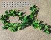 Sensación al tacto plástico simulación hojas de planta de ratán verde venta al por mayor enredadera ratán hojas verdes decorativas