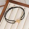 Pulsera tejida hecha a mano para parejas, de gran venta transfronteriza, con un estilo fresco y elegante, hebilla de herradura de aleación, pulsera ajustable