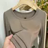 Camiseta Versátil de Manga Larga con Cuello en U y Canalé Suave Estilo Minimalista para Mujer Primavera/Otoño 2026 Estilo Coreano Elegante Que Reduce la Edad Top Combinable