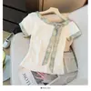 Camiseta Manga Curta Color Block Doce Estilo Coreano para Mulheres, Verão 2026, Acabamento Irregular com Fita, Corte Justo, Top Versátil, Tendência