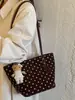 2026 Otoño/Invierno Diseño Nicho Retro Lunares Bolso Cubo Gran Capacidad Versátil para Viajes Diarios Bolso de Hombro Único Bolso de Axila